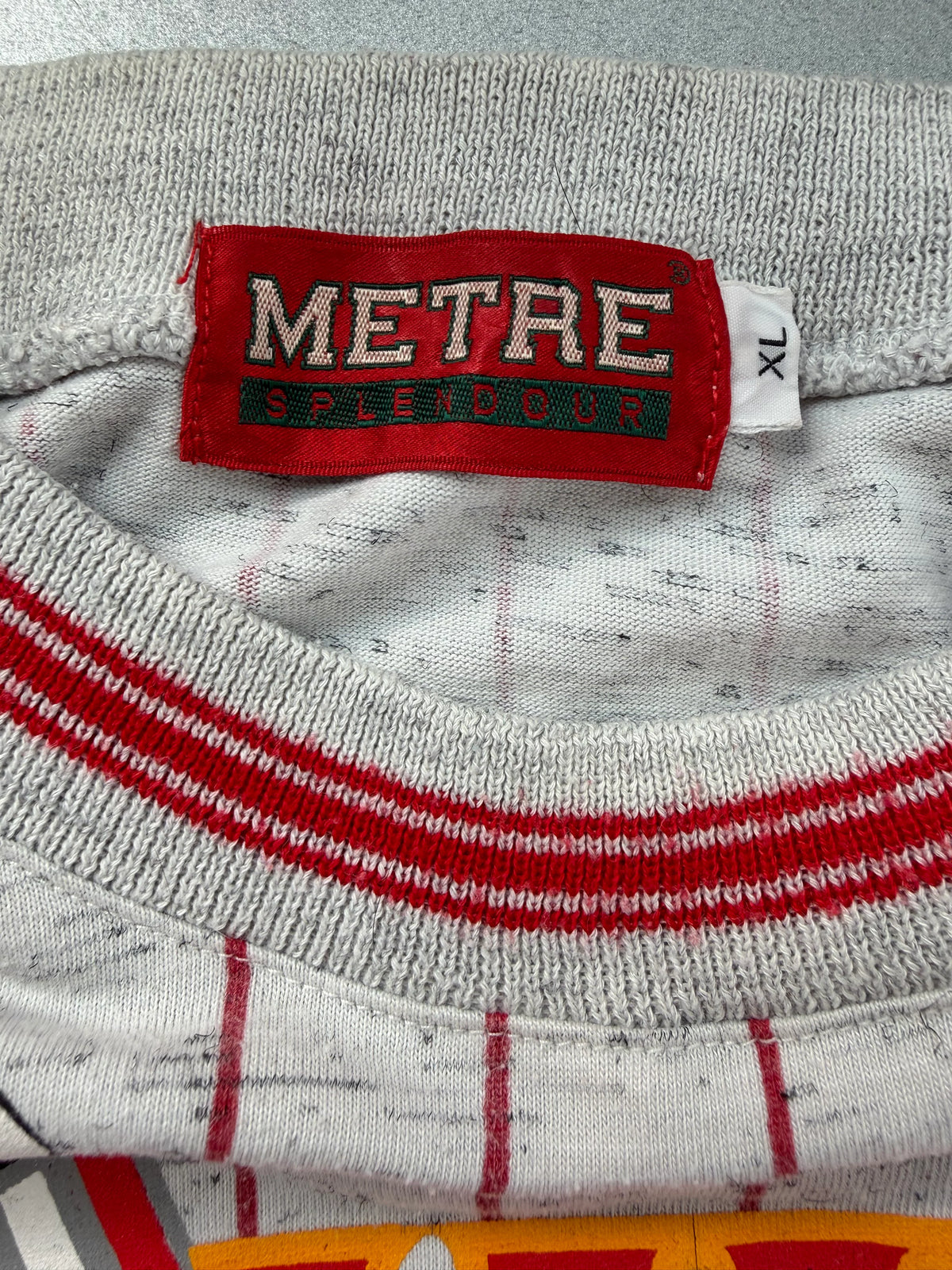 A light gray heathered pinstripe jacket with red stripes