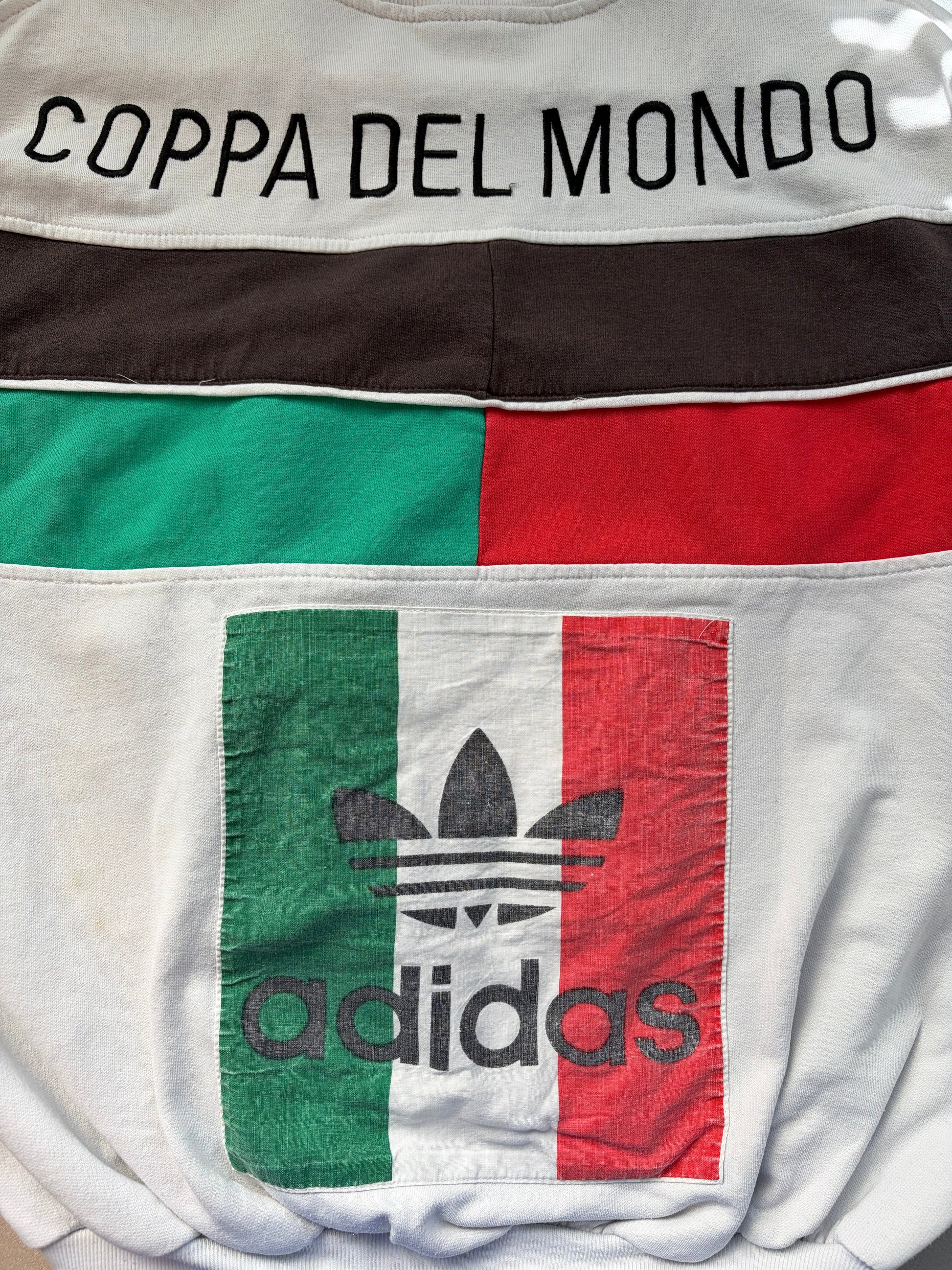  and red color-blocked stripes and a large Adidas trefoil logo with 'Coppa del Mondo' text on the back