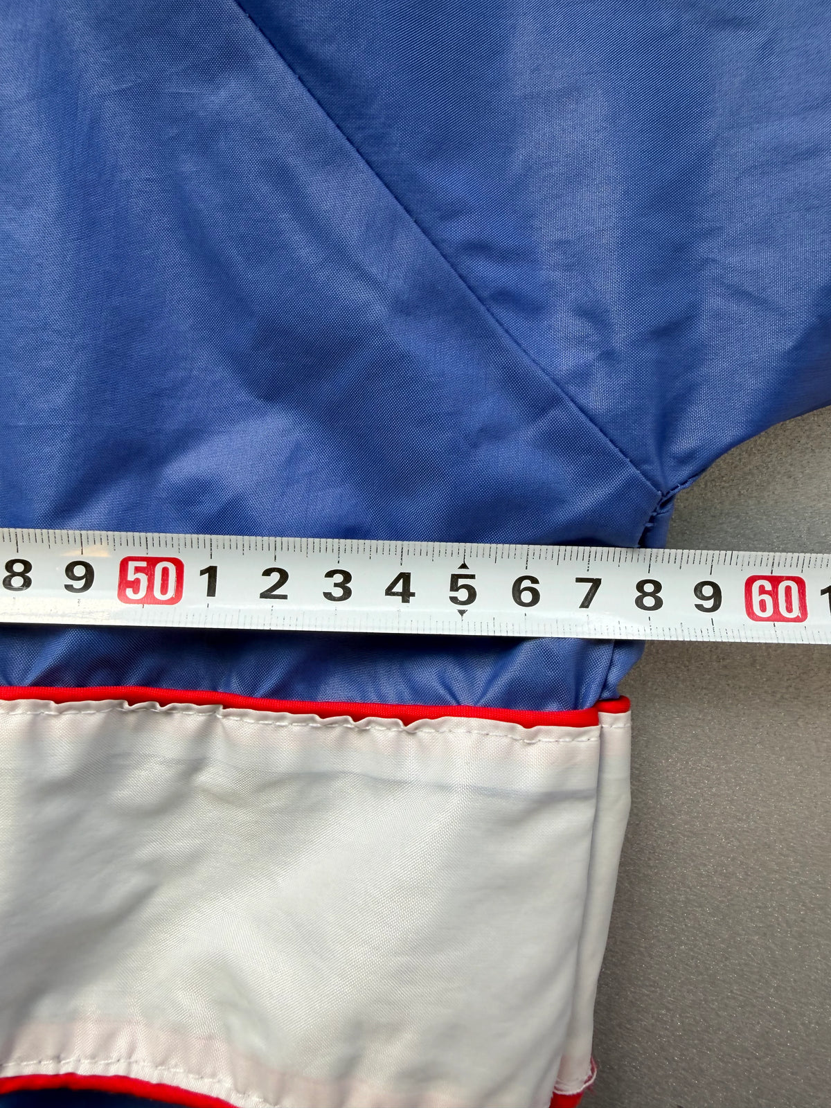  a horizontal white stripe with 'UMBRO' in blue text