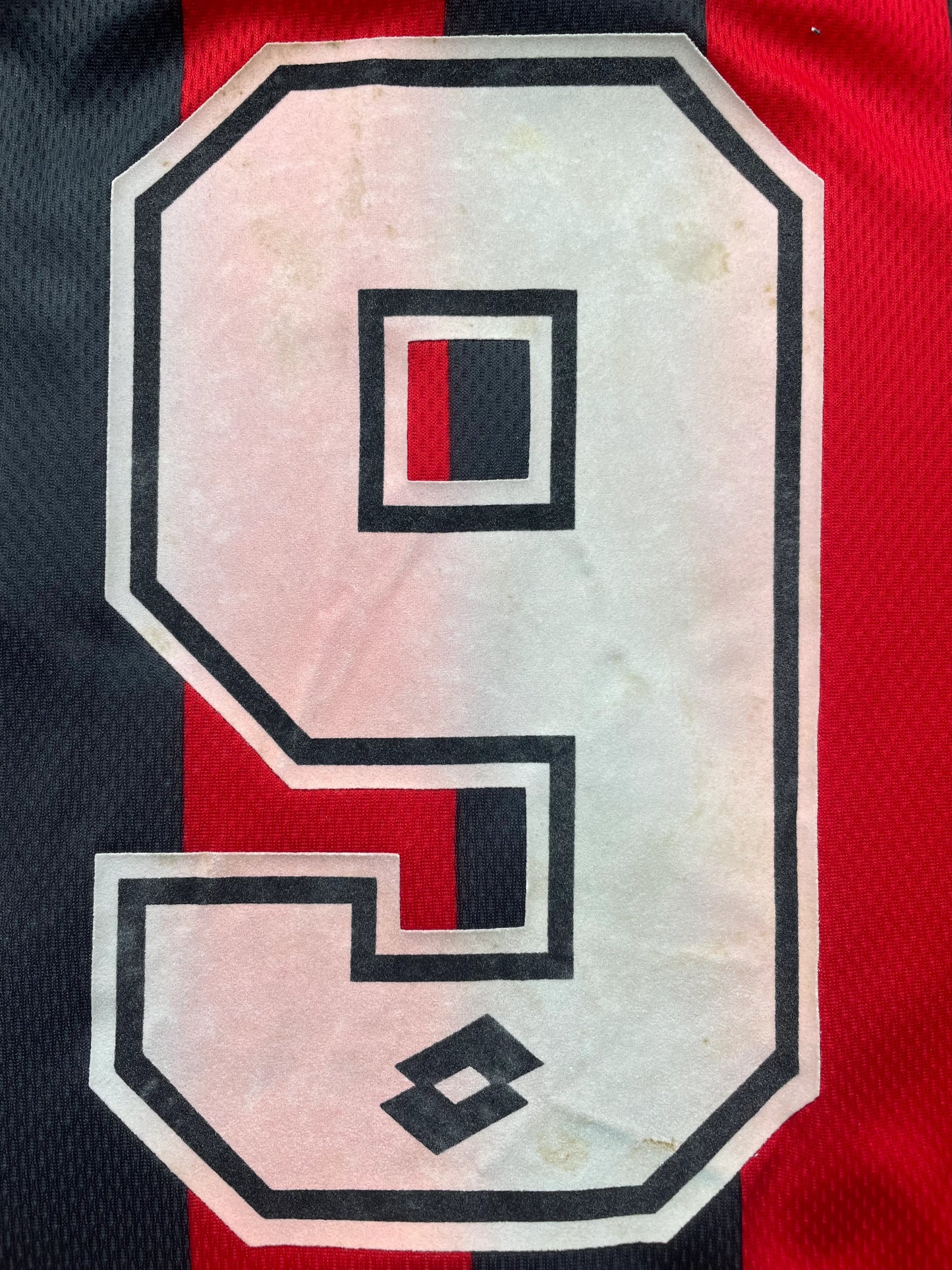 Red and black striped AC Milan 1996-97 Home jersey with 'VIERCHOWOD' and number '29' on a beige background
