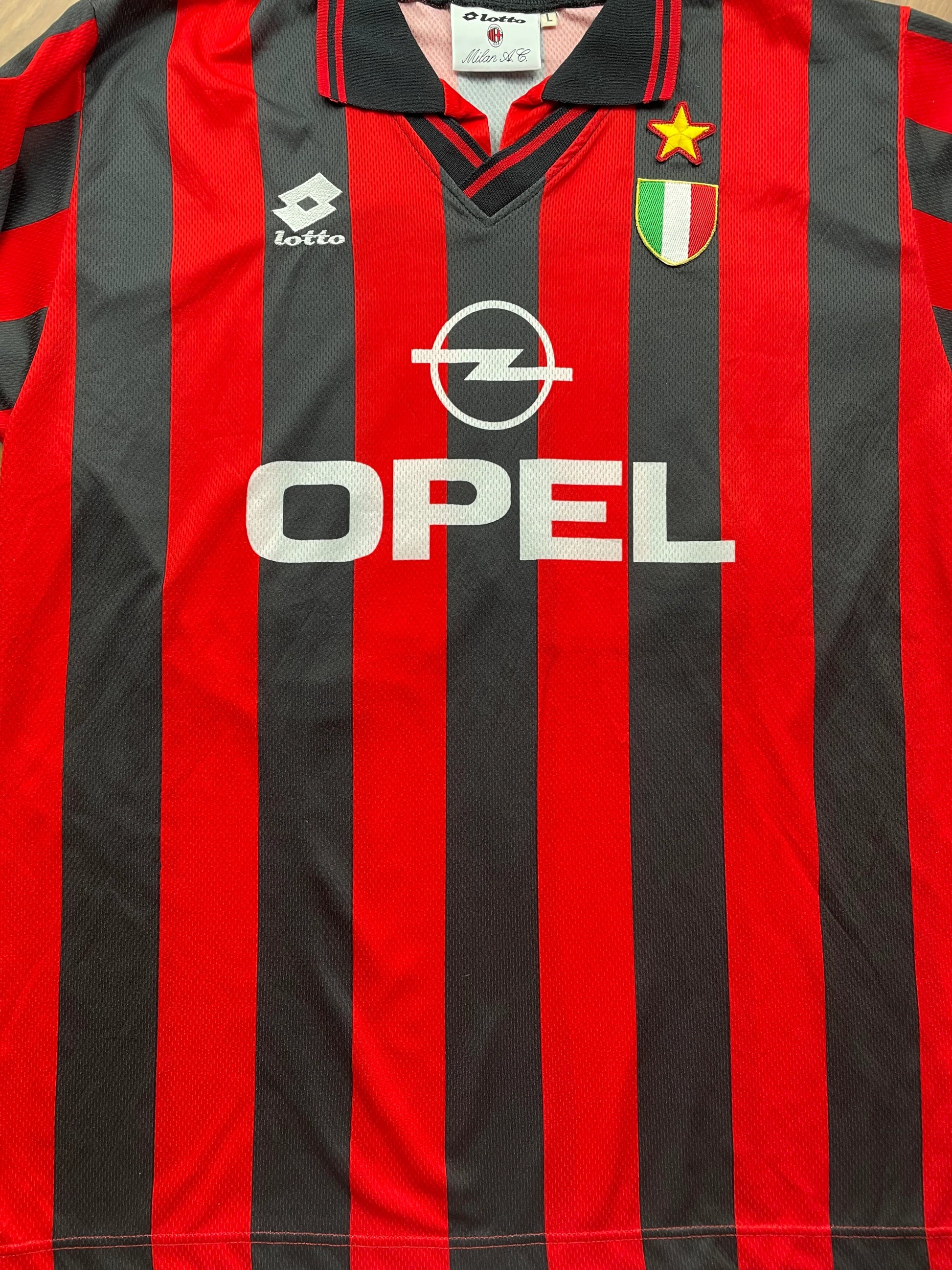 Red and black striped AC Milan 1996-97 Home jersey with 'VIERCHOWOD' and number '29' on a beige background
