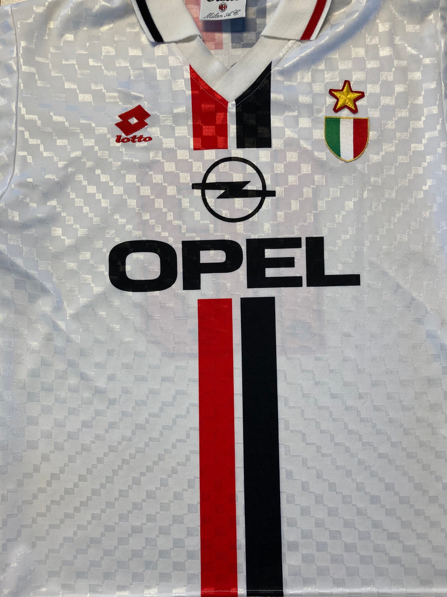 A vintage AC Milan soccer jersey by Lotto