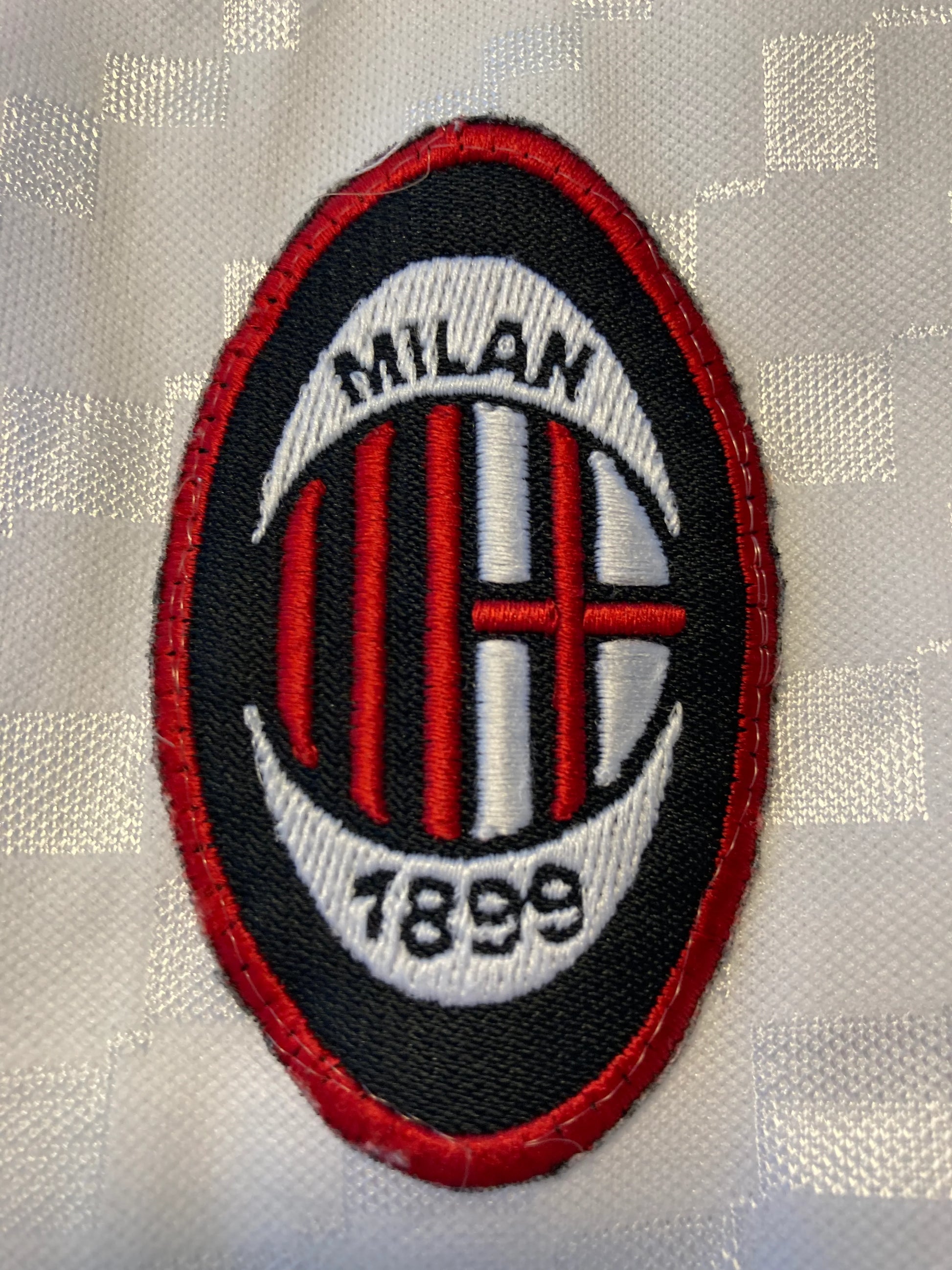  featuring a white textured pattern with red and black vertical stripes