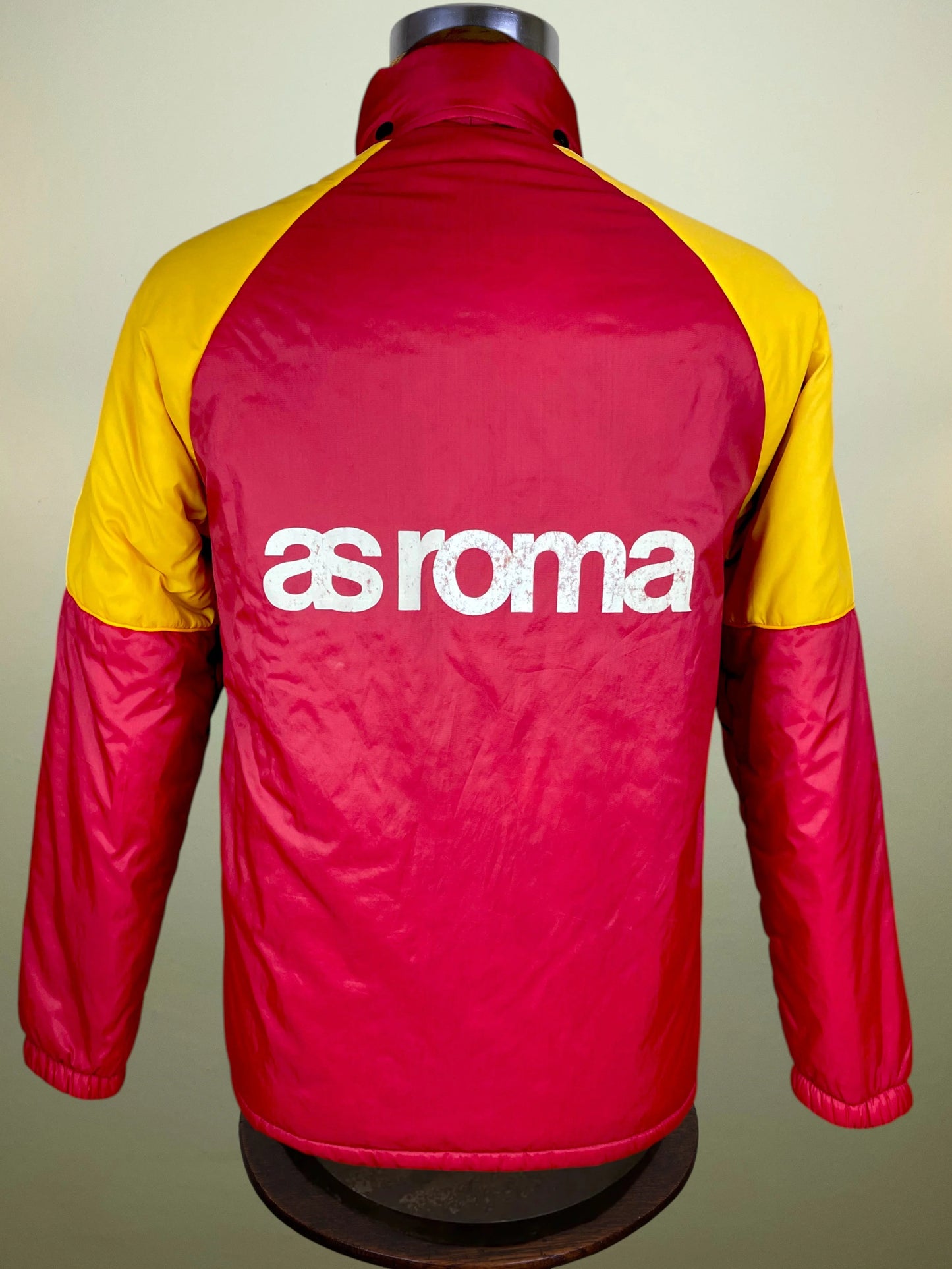  displayed on a mannequin torso. The jacket features a red body