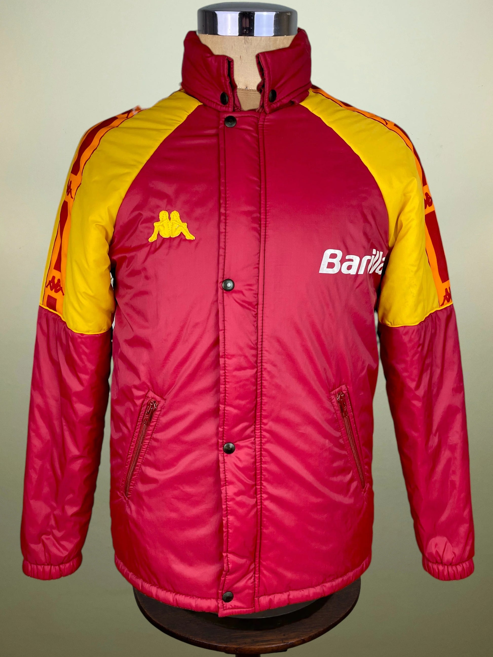A vintage Kappa windbreaker jacket in red and yellow