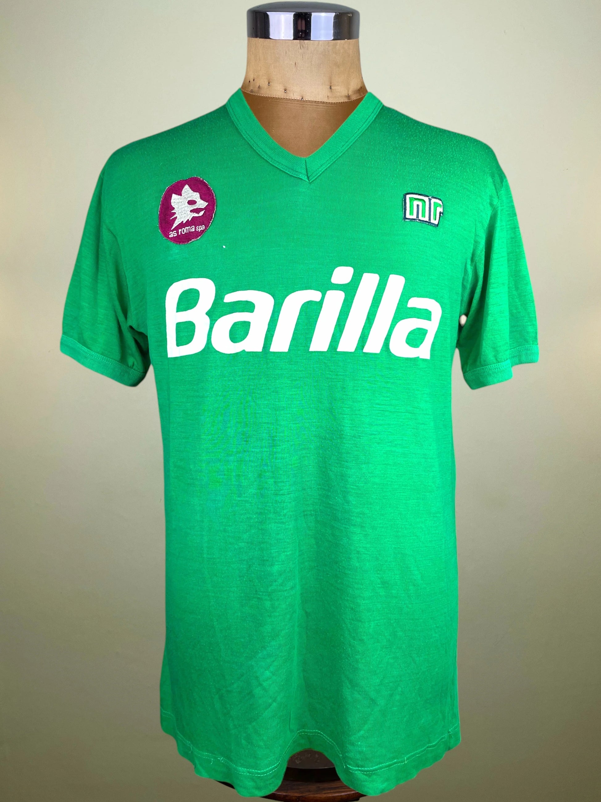 A green vintage Roma jersey with 'Barilla' printed in white across the chest