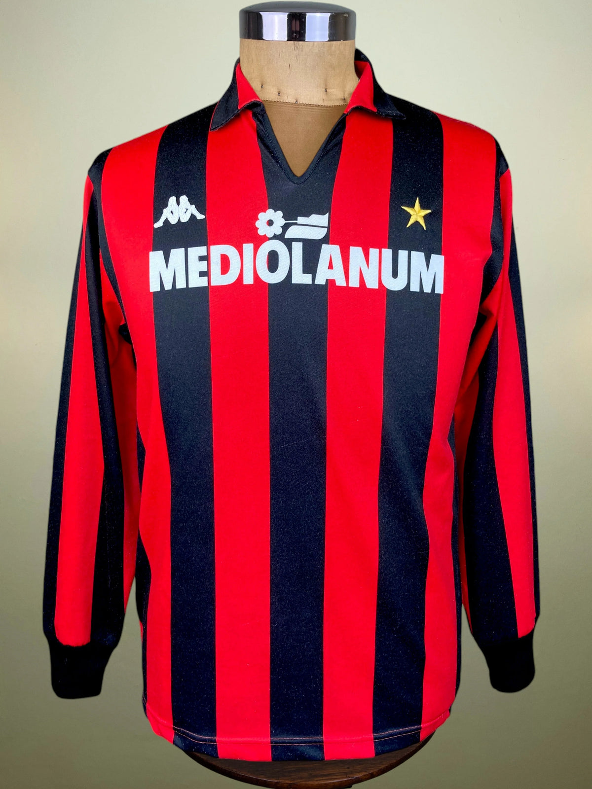 A vintage long-sleeve AC Milan jersey with red and navy blue vertical stripes