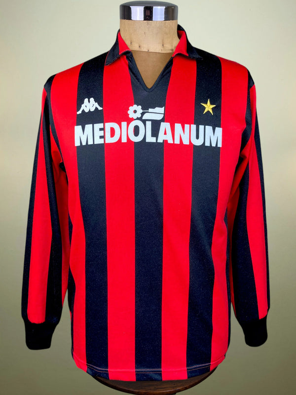 A vintage long-sleeve AC Milan jersey with red and navy blue vertical stripes