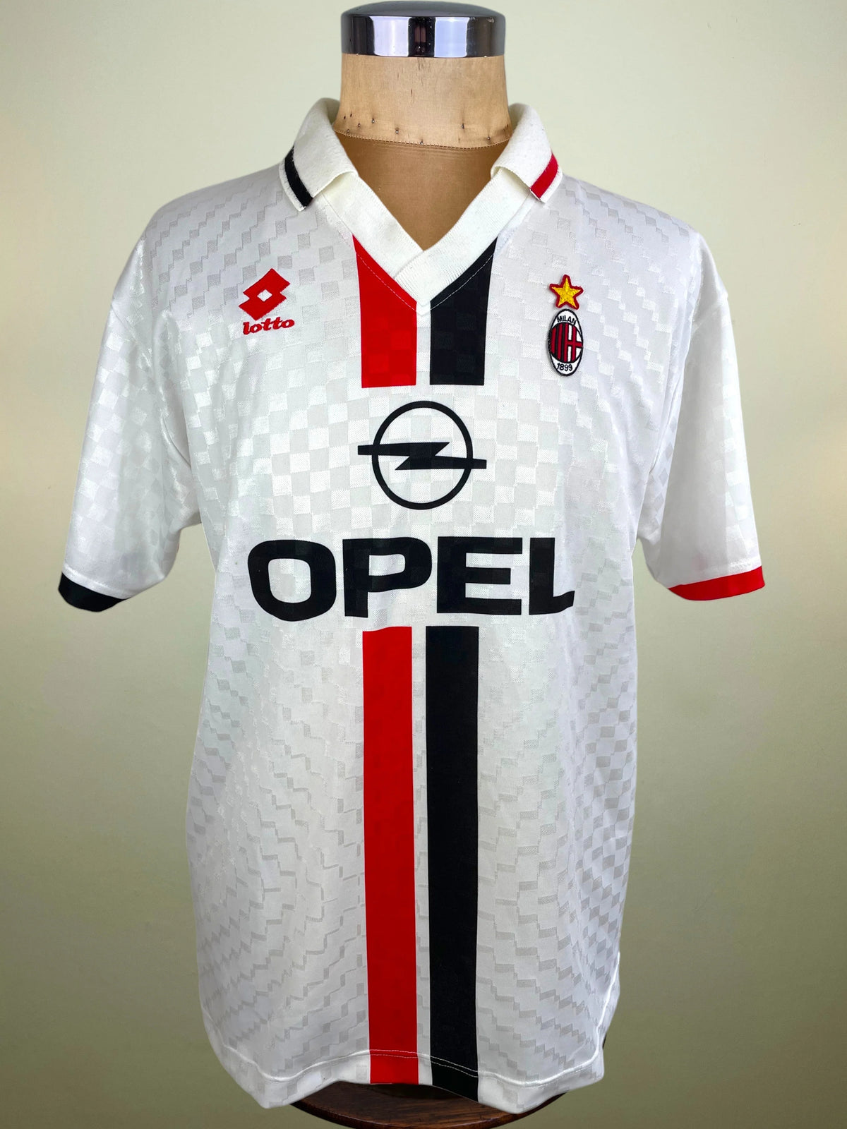A vintage AC Milan football jersey by Lotto