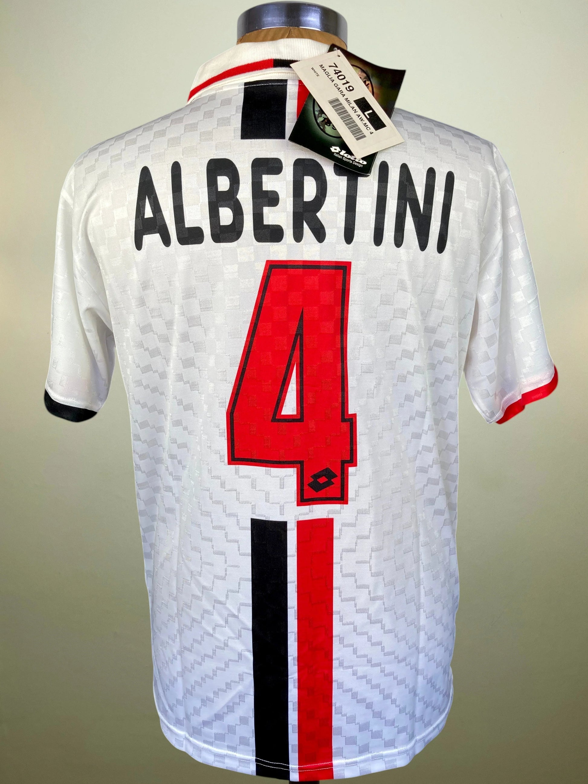 White AC Milan soccer jersey shown from the back on a mannequin