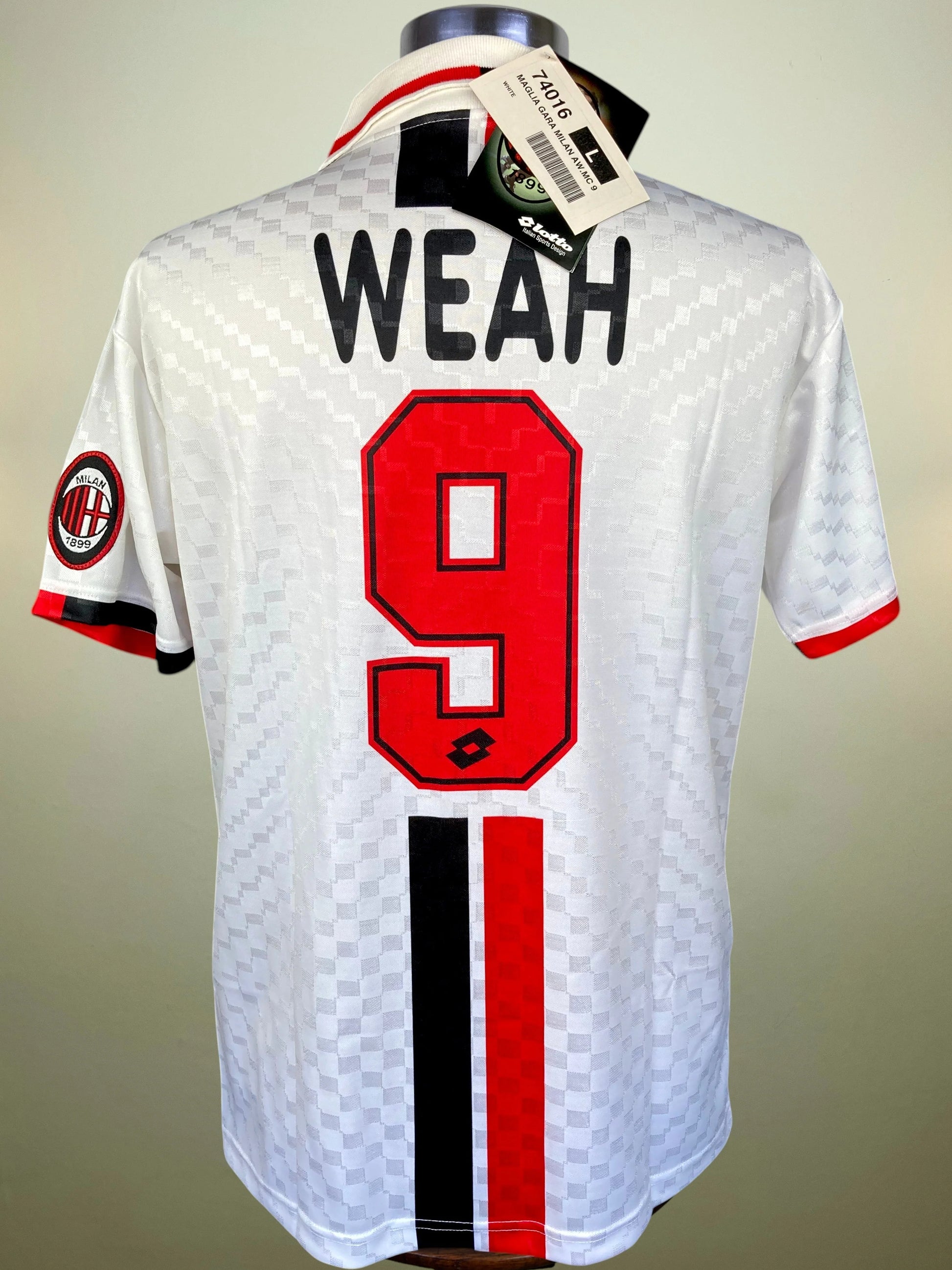 White AC Milan soccer jersey with 'WEAH' and number 9 on the back