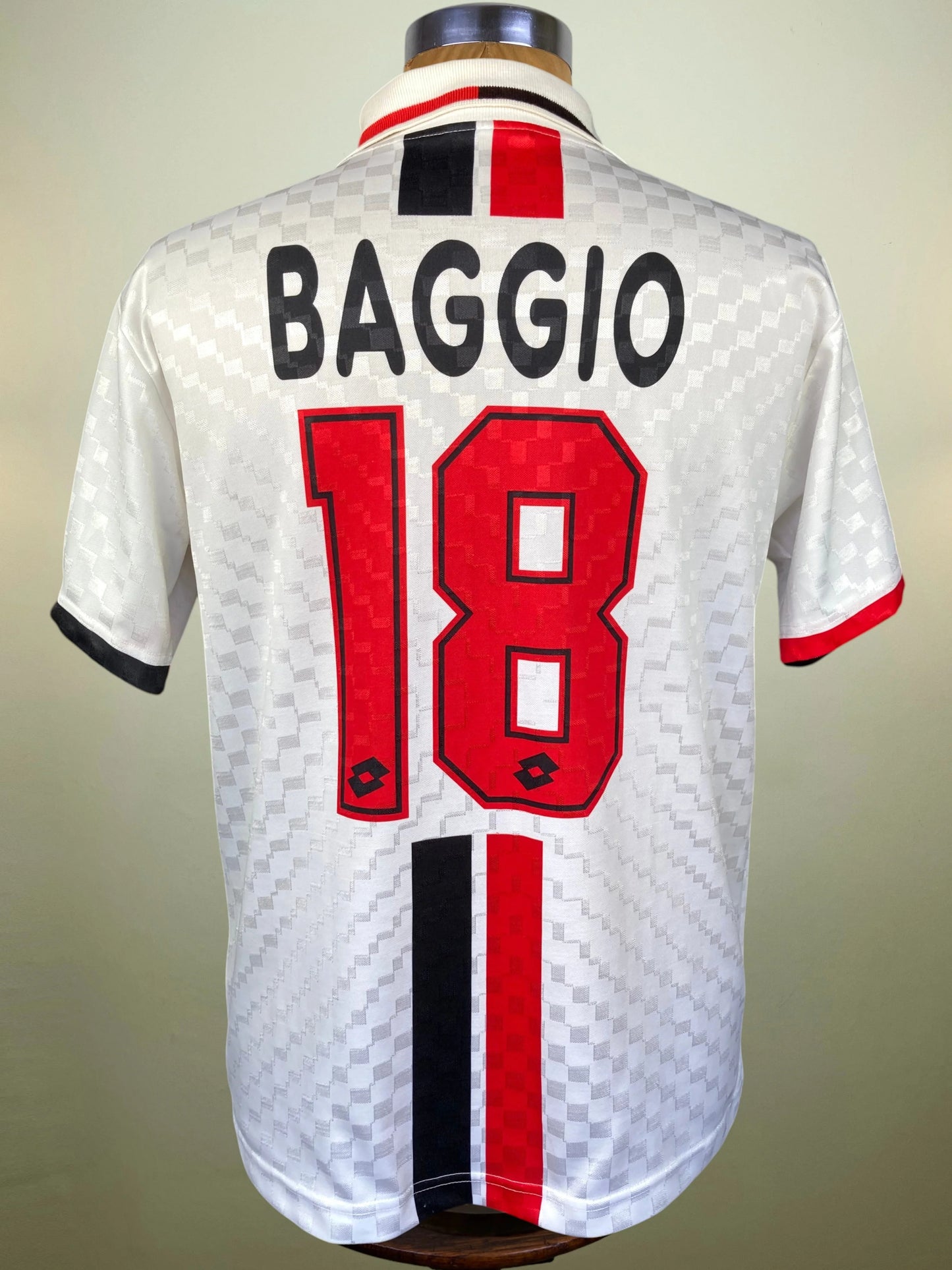 Back view of a white Inter Milan soccer jersey on a mannequin