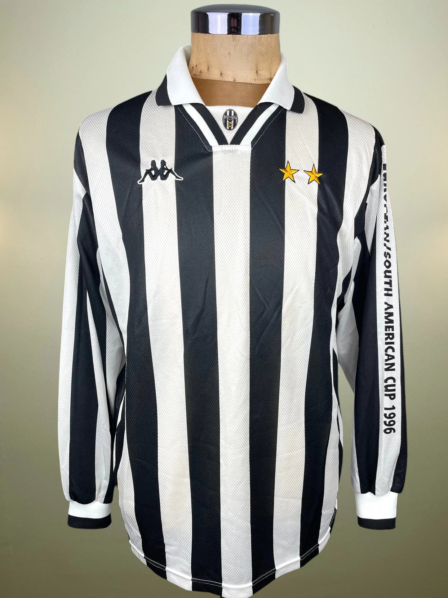 A vintage long-sleeve Juventus football jersey with black and white vertical stripes