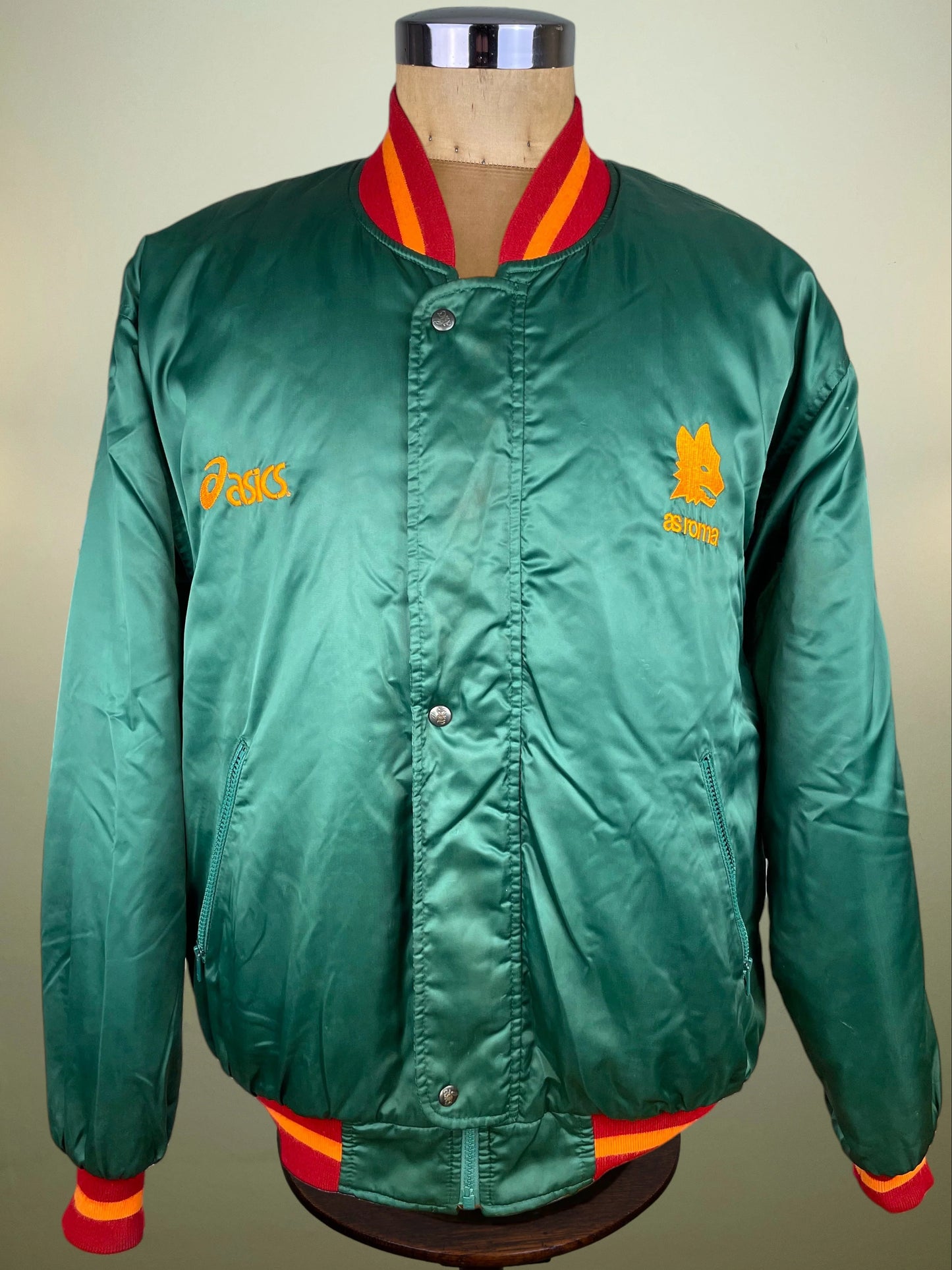  featuring a large white wolf logo and the text 'ASICS FOOTBALL TEAM' and 'asics' printed across the back